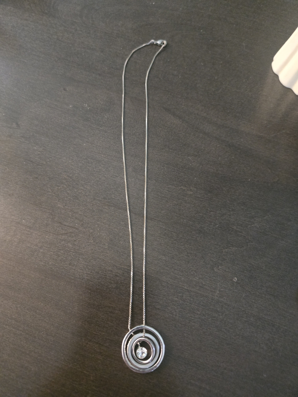 Silver Tone Circular Pendant Necklace with Crystal Accent